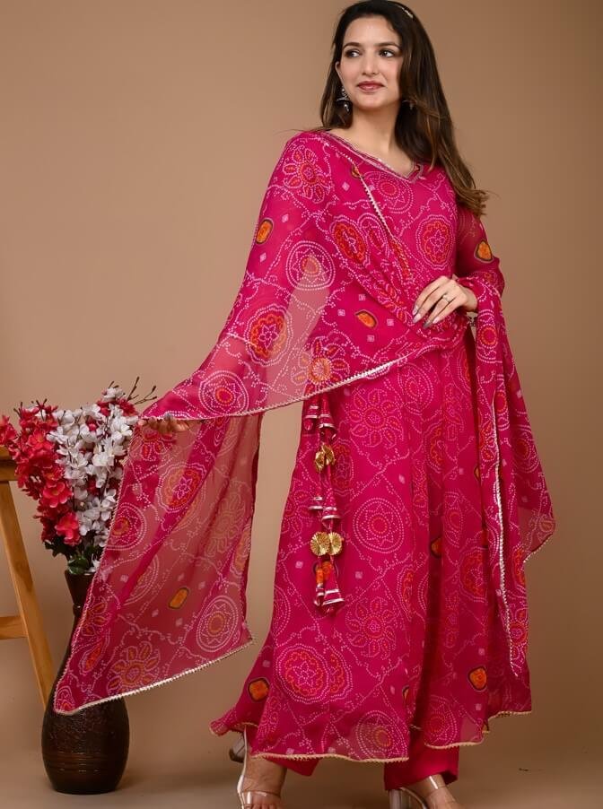 Get ready to shine with the Magenta Pink Chiffon Bandhani Printed Anarkali Suit Set!