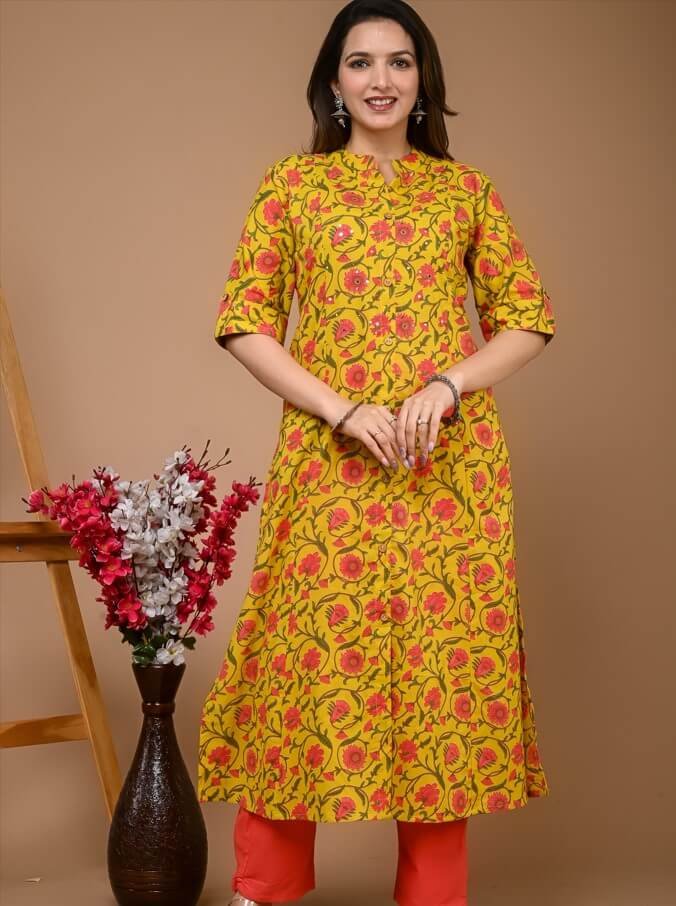 Add some sparkle with a yellow cotton kurta and pant set with floral prints.