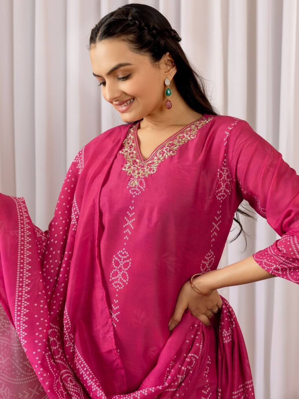 Improve your style with a Magenta Pink Muslin Silk Bandhani Printed Kurta, paired with matching pants and a dupatta. image 2