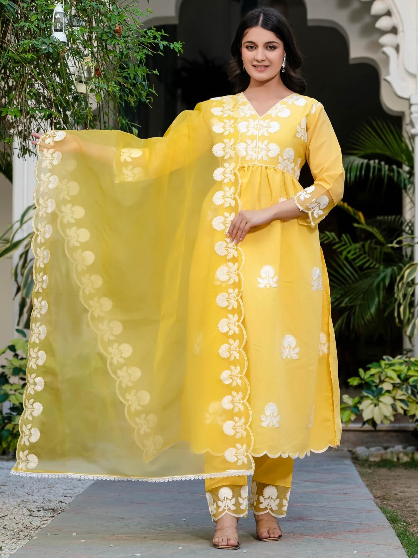 Upgrade your style with a yellow Roman silk kurta and pants set, complete with a matching dupatta.