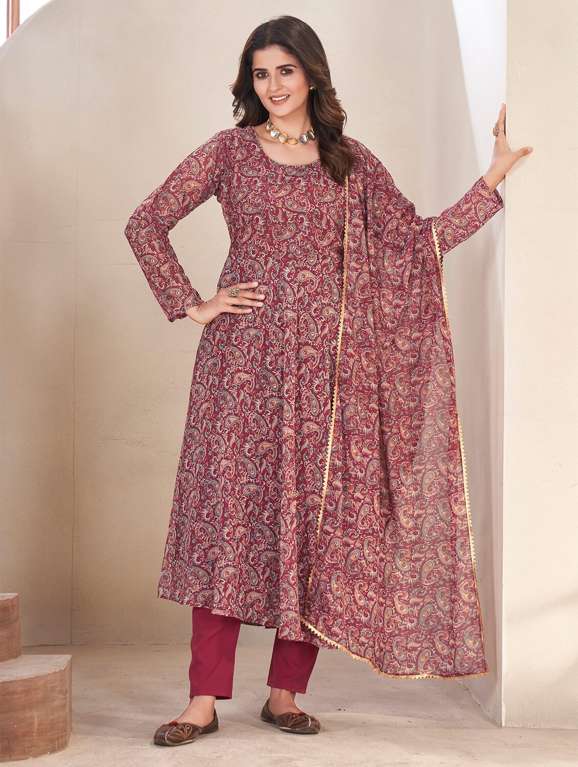 Experience elegance with the Maroon Georgette Printed Anarkali Suit Set.