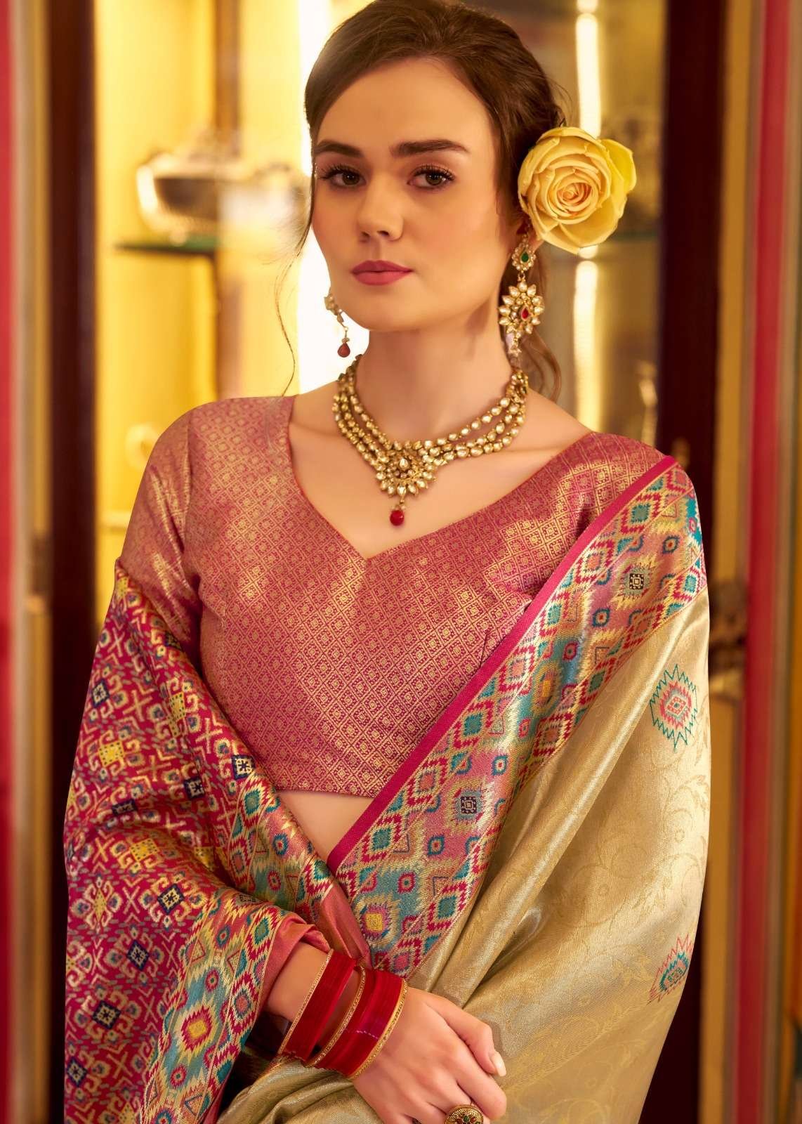 Step into elegance with a beige tissue Patola silk saree and a beautiful blouse piece. image 2