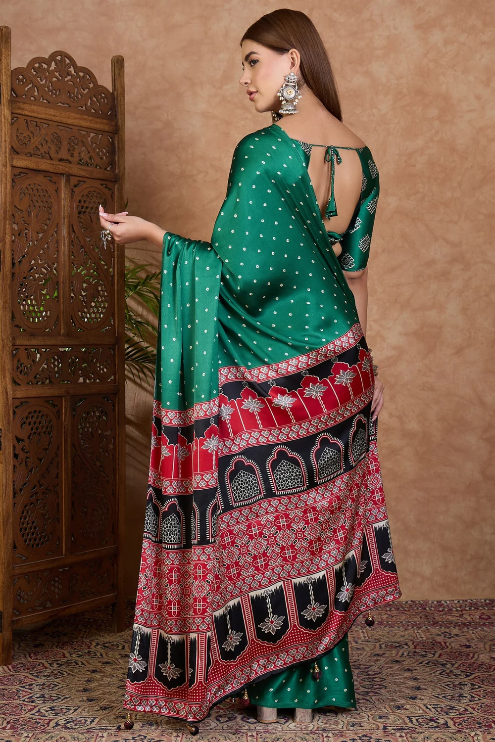Step into style with a green semi-modal saree and blouse piece. image 2