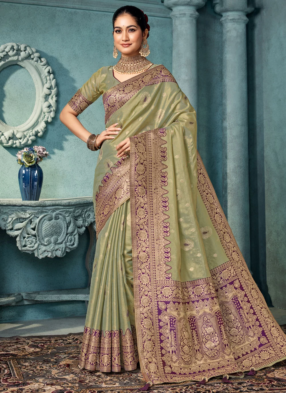 Experience the elegance of a green silk saree with beautiful weaving work.