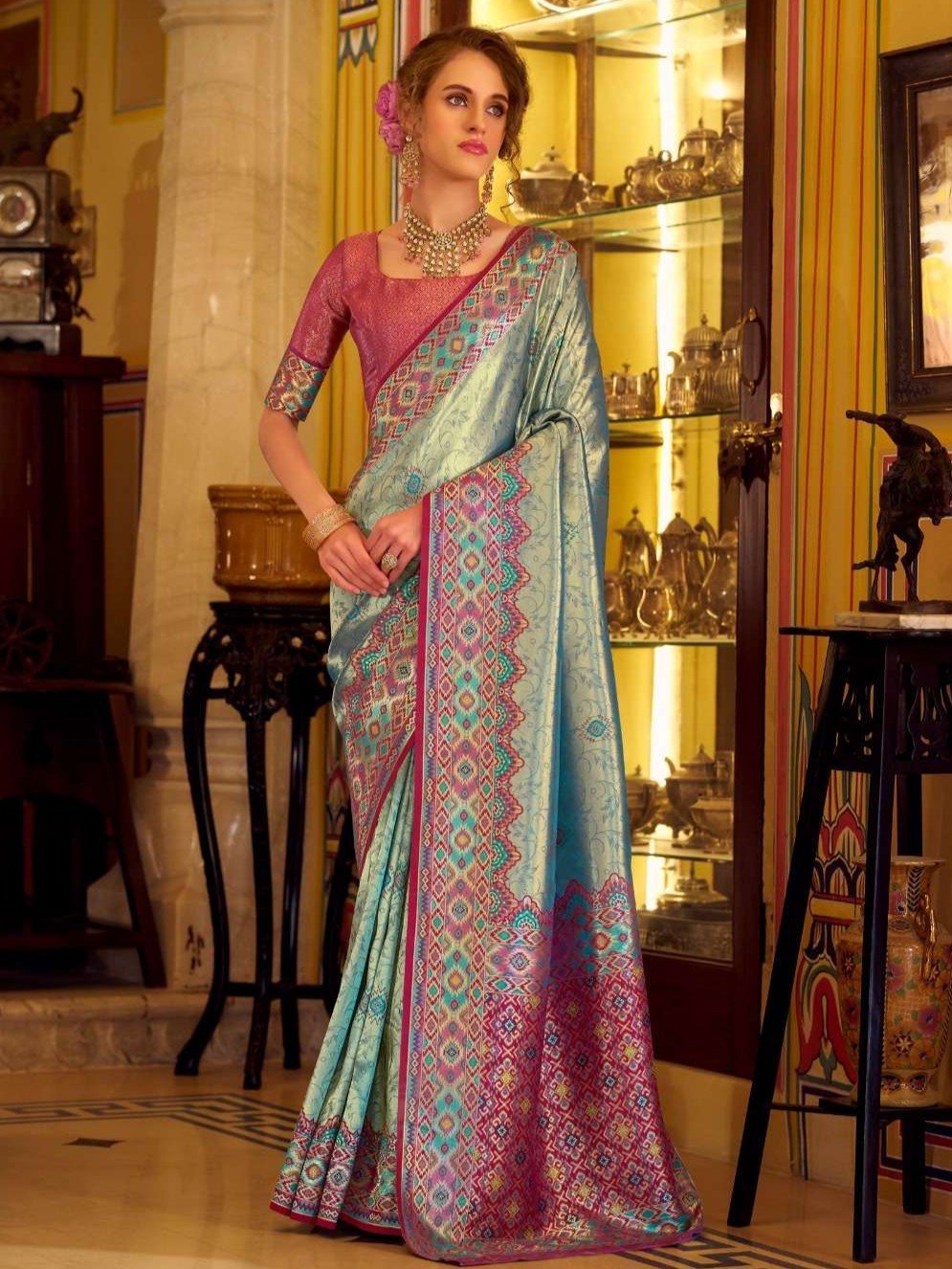 Experience elegance with the Blue Tissue Patola Silk Saree and its beautiful blouse piece.