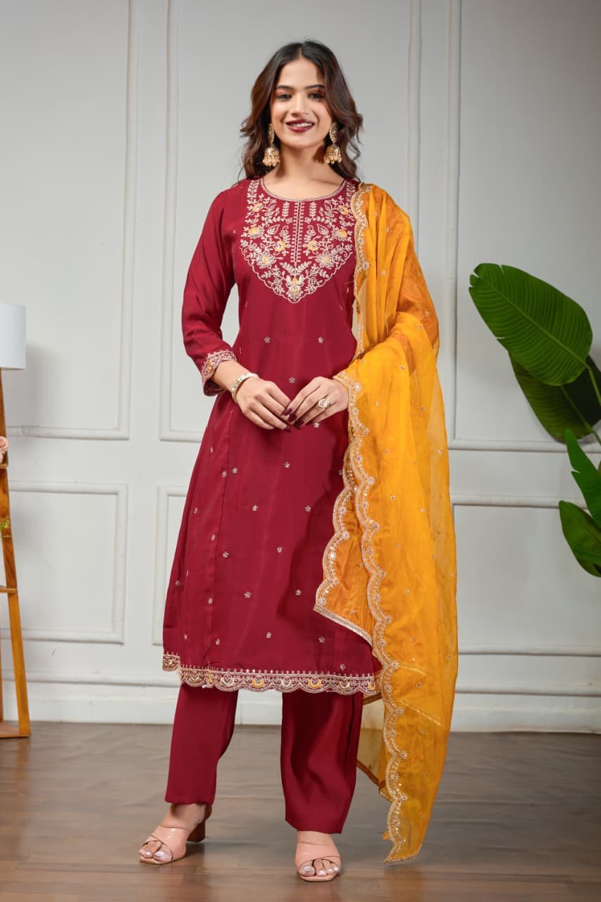 Experience elegance with a maroon Roman silk Anarkali suit paired with a contrasting organza dupatta.
