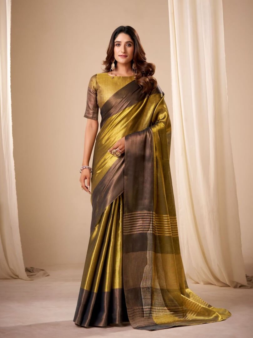 Add a touch of glamour with a golden handloom tissue silk saree and matching blouse piece.