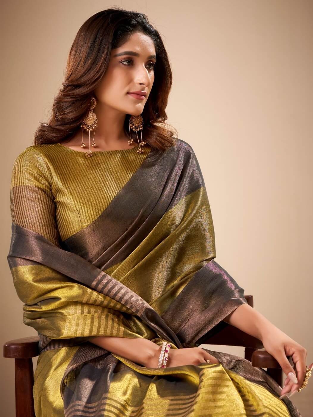 Add a touch of glamour with a golden handloom tissue silk saree and matching blouse piece. image 2