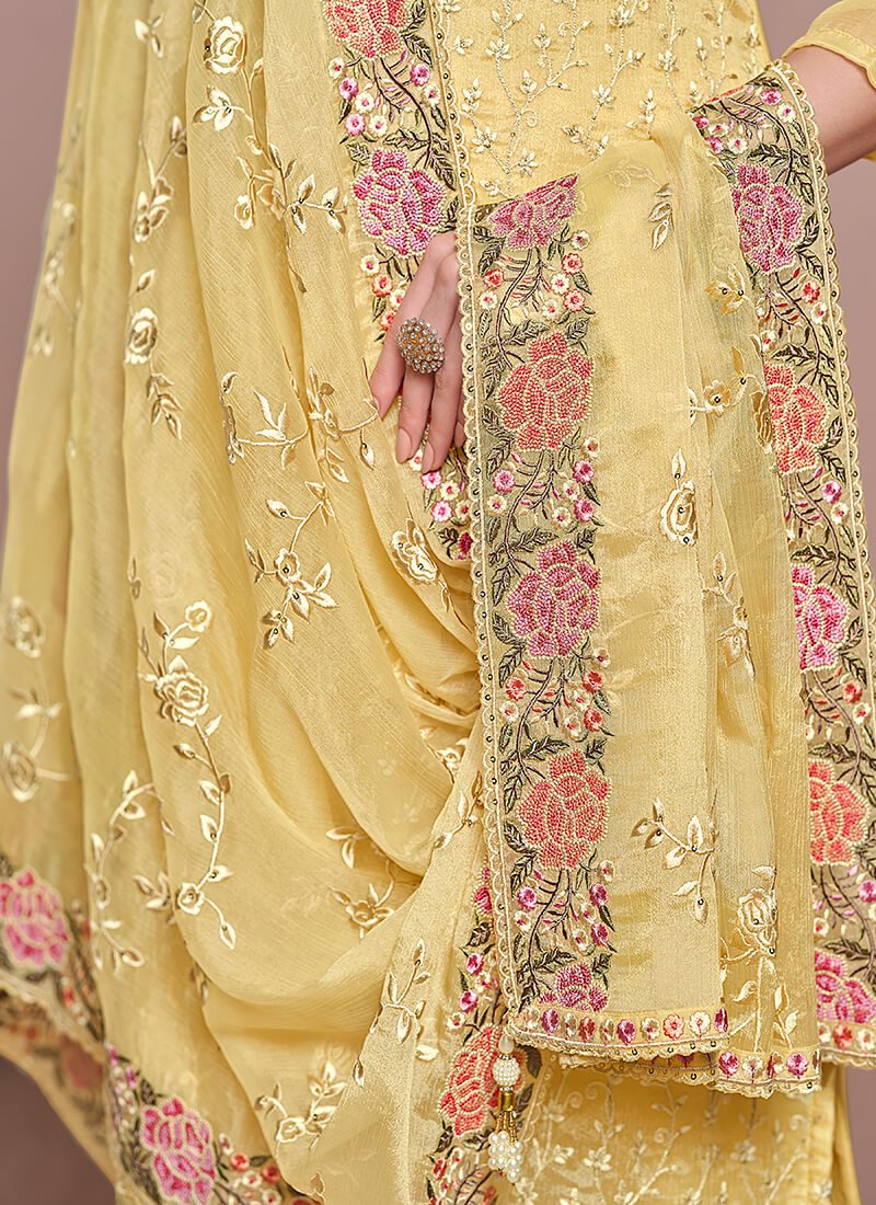 Experience the elegance of the Yellow Embroidered Chiffon Semi-Stitched Salwar Kameez Set. image 3