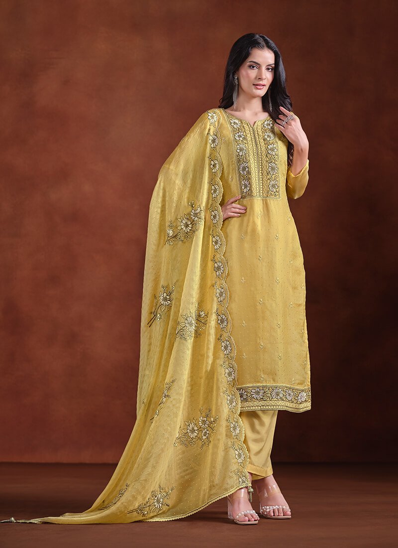 Add some sparkle with a yellow embroidered organza semi-stitched Salwar Kameez set.