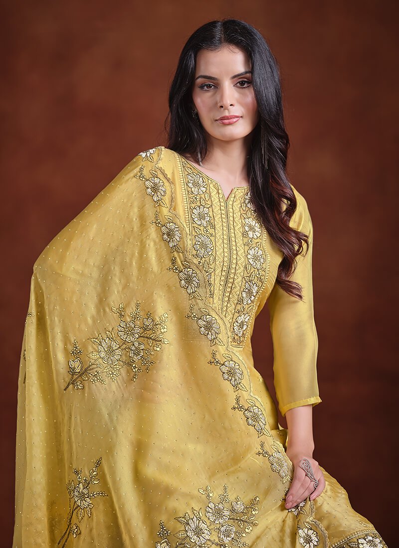 Add some sparkle with a yellow embroidered organza semi-stitched Salwar Kameez set. image 2