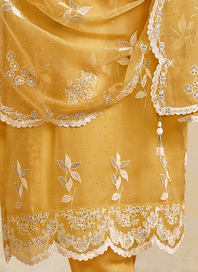 Add sparkle with a yellow semi-stitched salwar kameez set made of embroidered organza chiffon. image 3