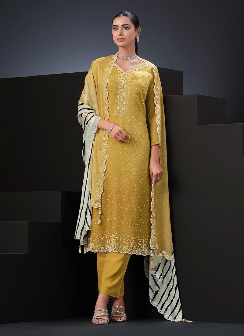 Upgrade your style with a yellow satin semi-stitched salwar kameez set.