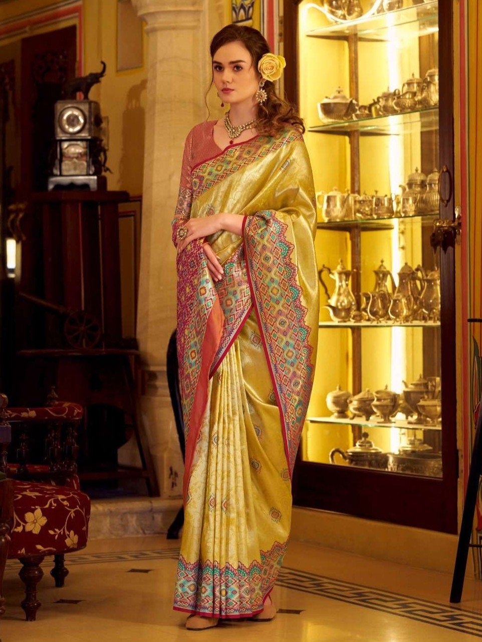 Look Stylish with a Yellow Tissue Patola Silk Saree and Trendy Blouse Piece