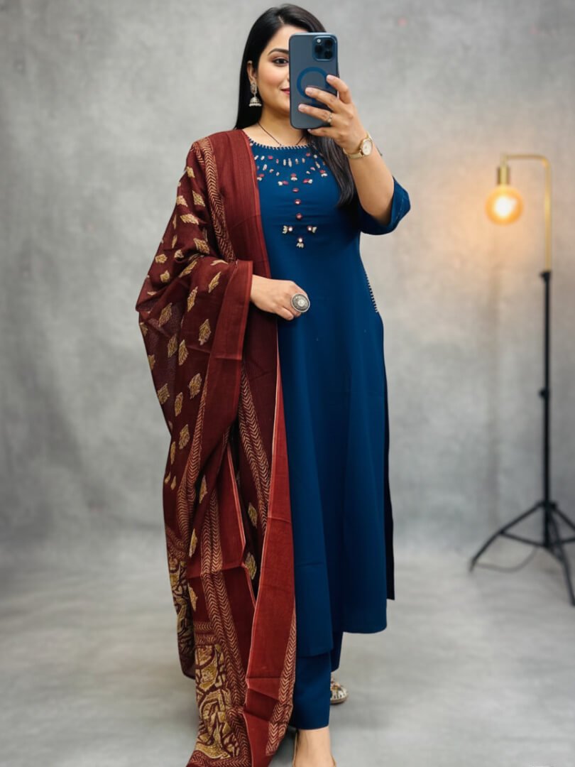 Upgrade your style with a blue cotton kurti, pants, and a printed mulmul dupatta.
