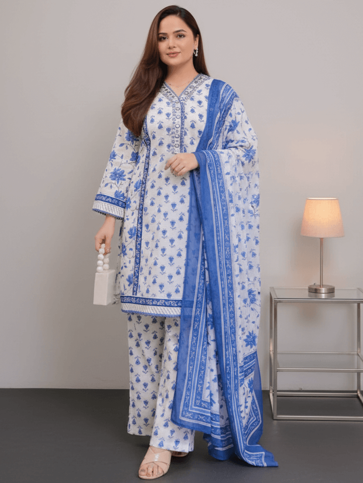 Enhance your look with a blue floral cotton short kurta, paired with matching pants and a dupatta.