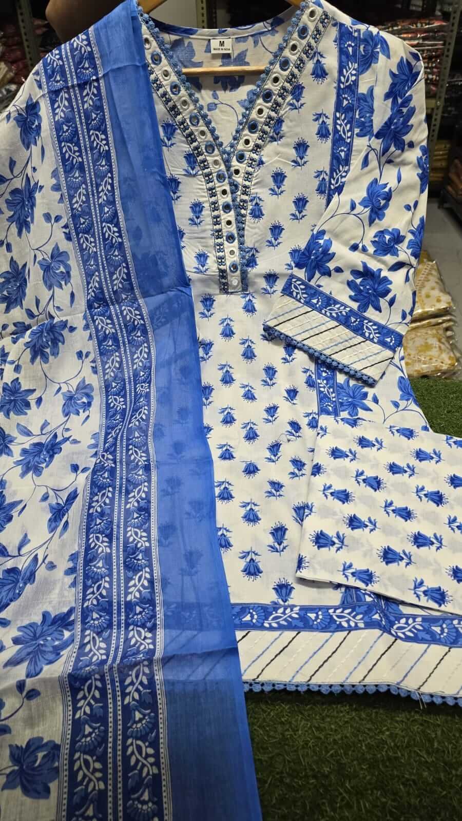 Enhance your look with a blue floral cotton short kurta, paired with matching pants and a dupatta. image 3