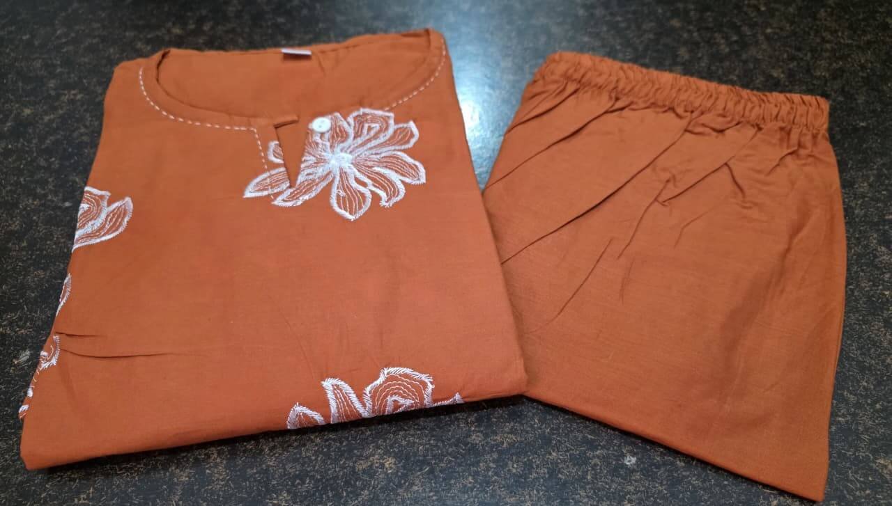 Experience the elegance of a rust-colored cotton kurti with matching pants. image 4