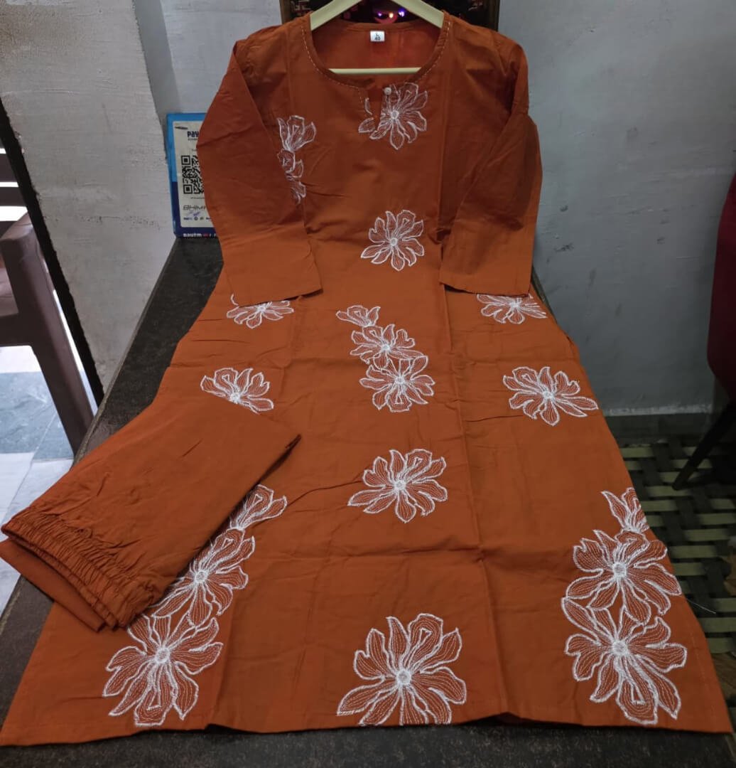 Experience the elegance of a rust-colored cotton kurti with matching pants. image 5