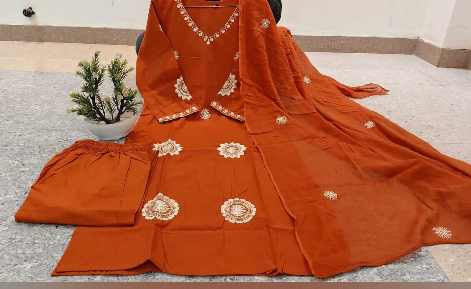 Experience elegance with the orange cotton kurta, pants, and dupatta set featuring beautiful embroidery. image 3
