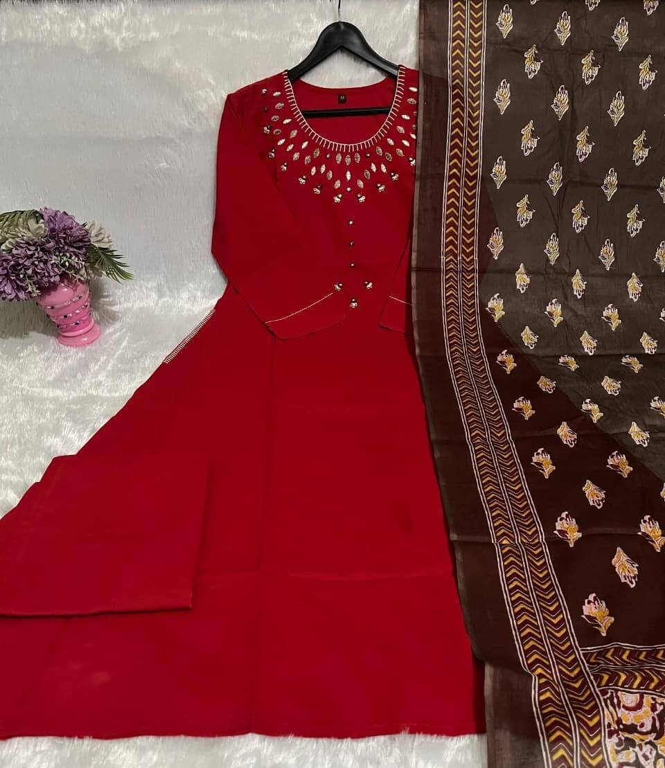Step into style with a red cotton kurti, matching pants, and a printed mulmul dupatta. image 3