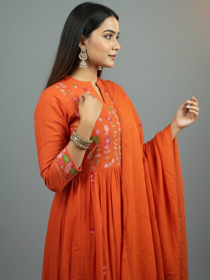 Enhance your look with an orange embroidered cotton kurti, paired with pants and a soft mulmul dupatta. image 2