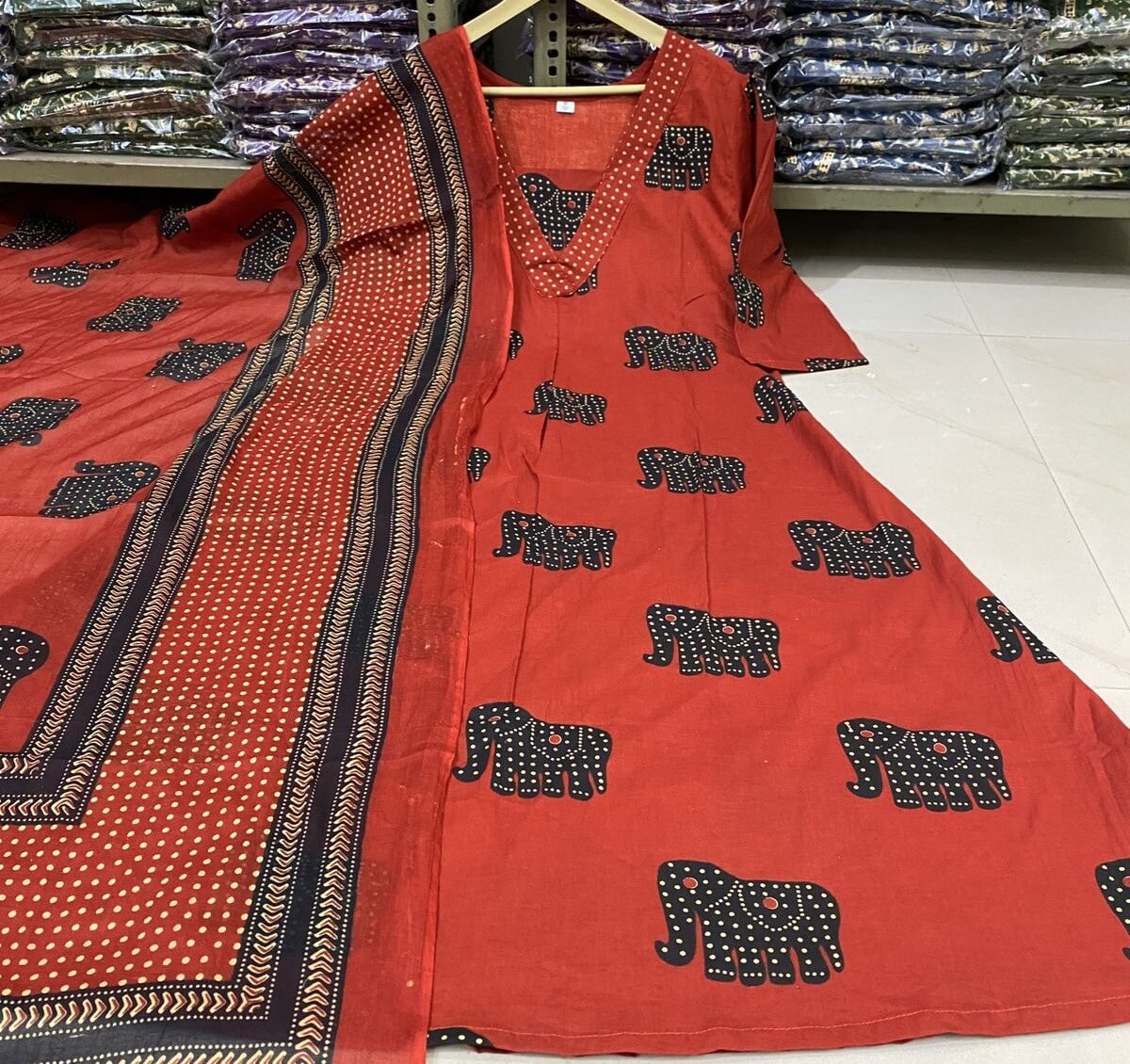 Step into style with a red animal print cotton kurta, pant, and dupatta set. image 3